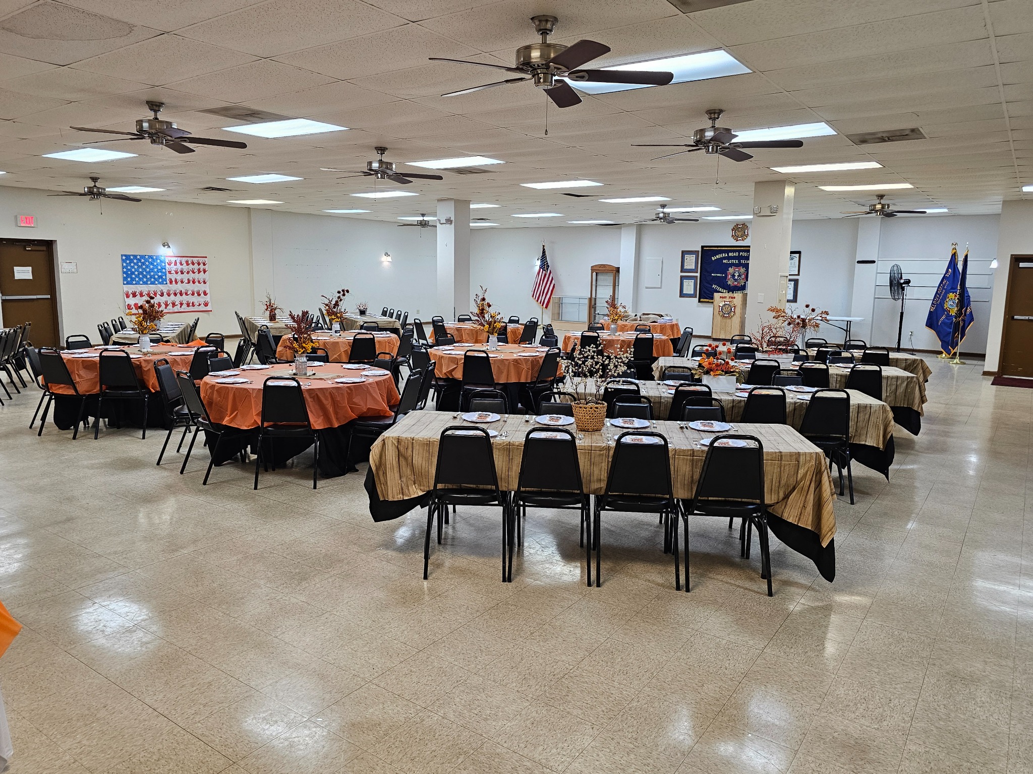 Autumn-themed community dinner setup in the hall