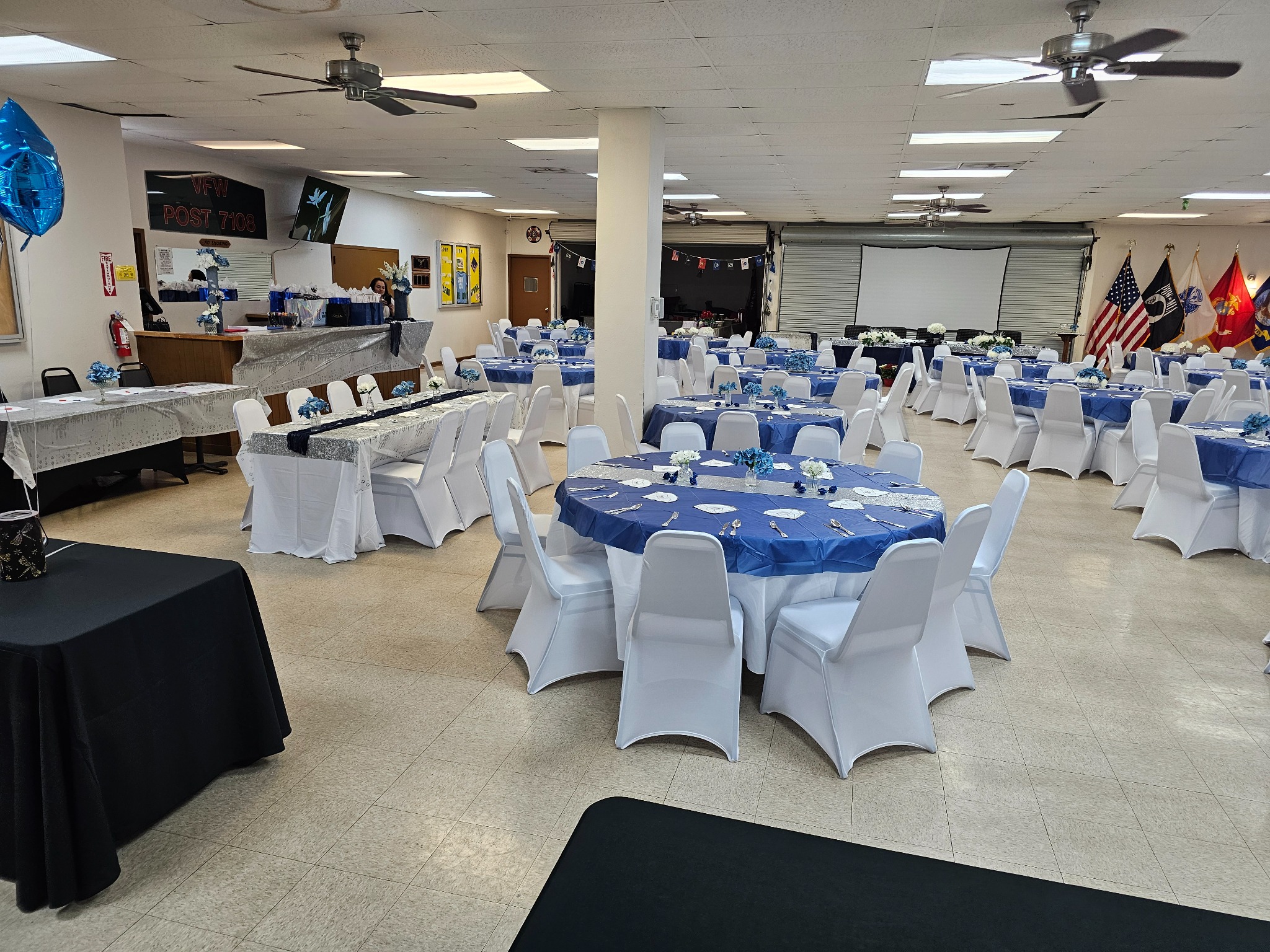 Formal blue and white table arrangement inside VFW Post 7108