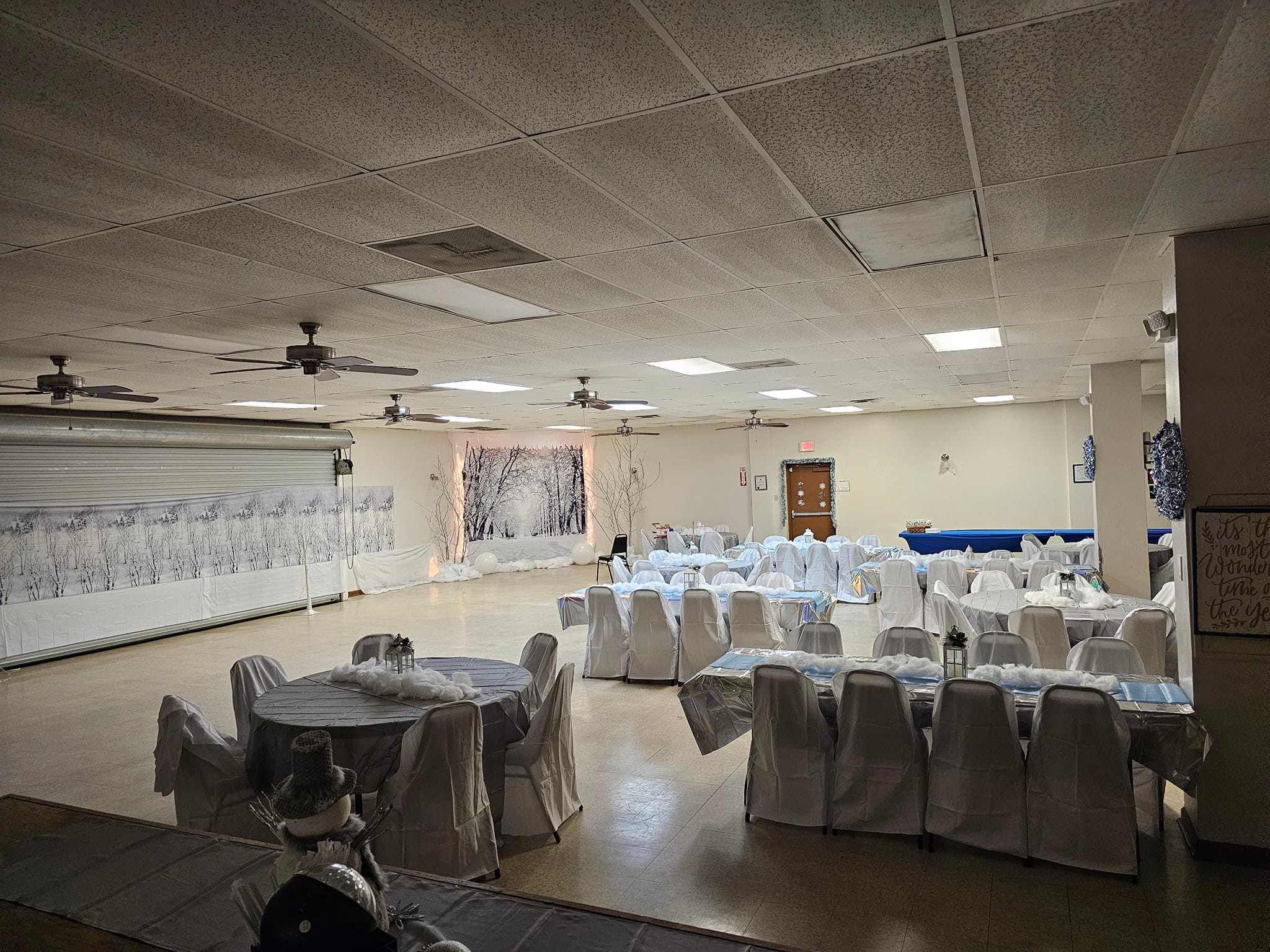 Open floor plan with tables and a large dance area